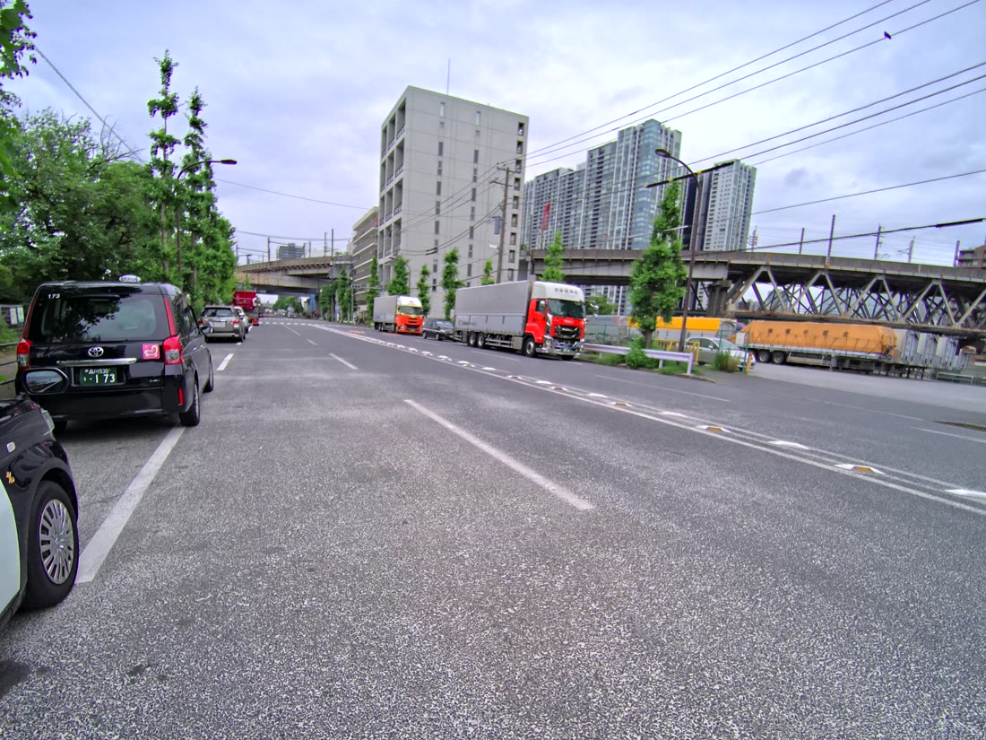 An example 4K source image extracted from PortalCam's raw data and converted from fisheye to perspective projection (a road and high-rise buildings)